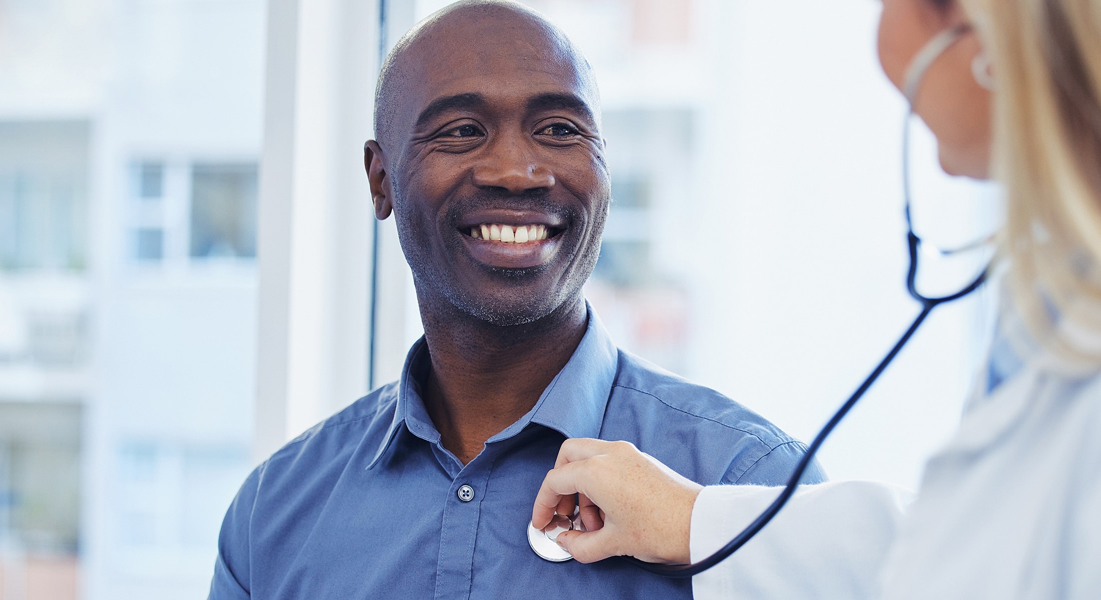 Patient smiling during a medical check-up.